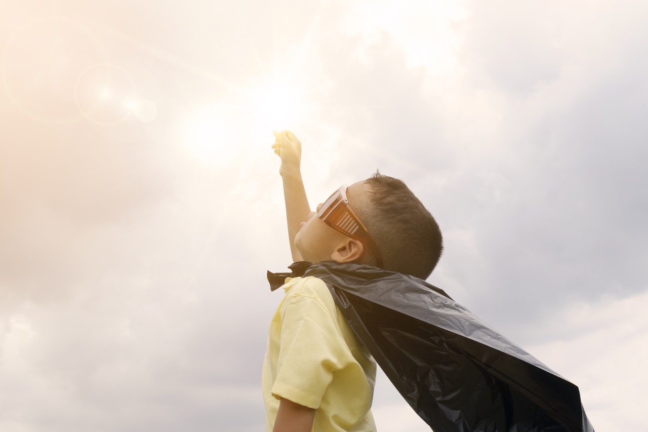 Child in superhero cape