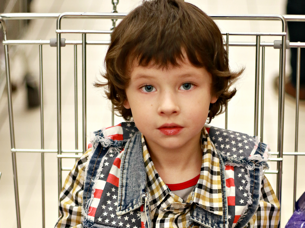 boy in shopping cart
