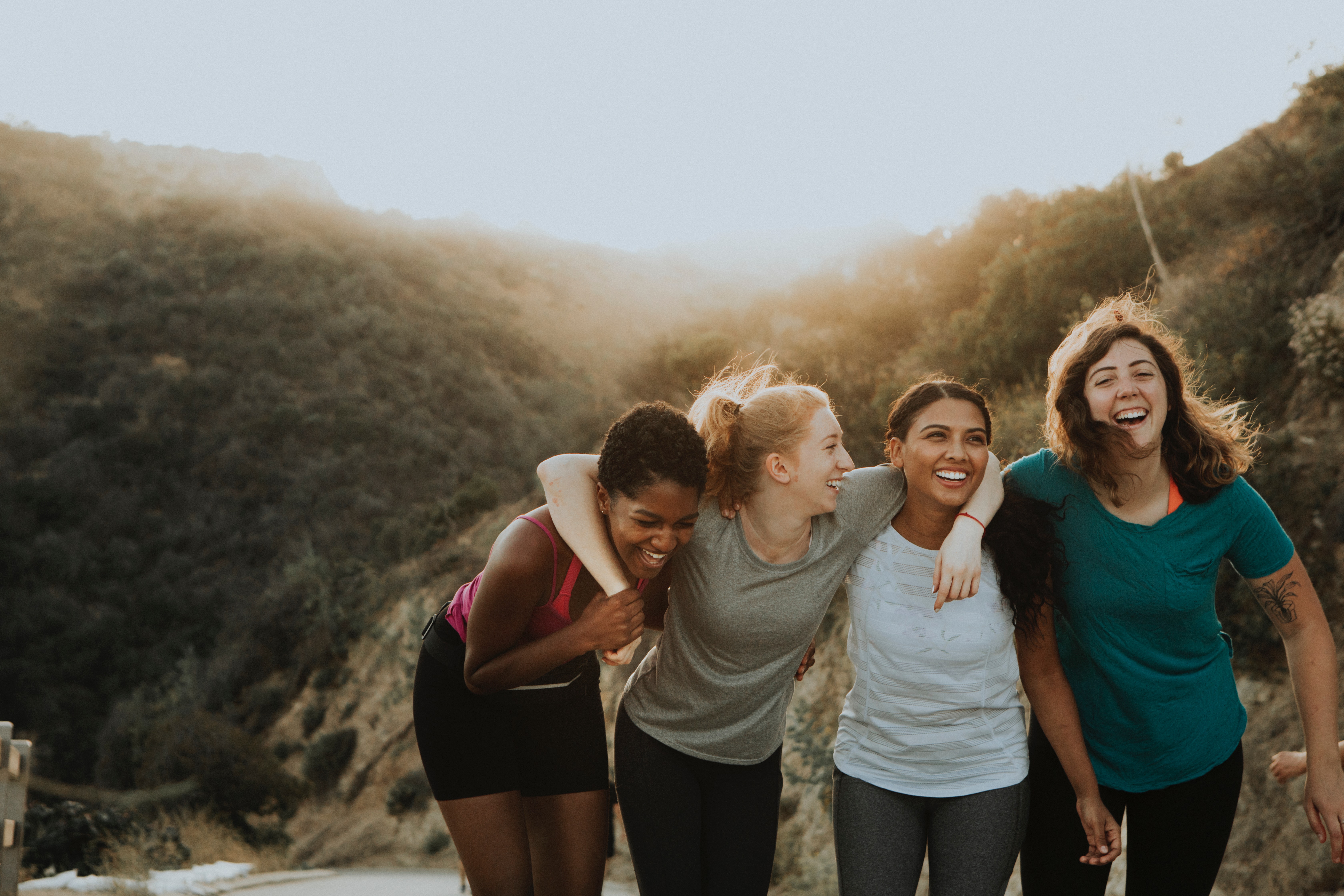 Four teen girlfriends at the beach